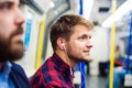 Young men in subway Royalty Free Stock Photo