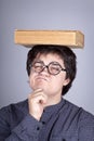 Young men thoughtful men with book over head. Royalty Free Stock Photo