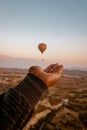 Young men on vacation Cappadocia Turkey sunrise in the hills with hot air balloons, Kapadokya Beautiful vibrant colorful Royalty Free Stock Photo