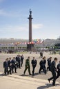 Young men walk on Dvortsovaya square in Saint-Petersburgm Russia.