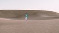 Young men walking at the beach of Maspalomas Gran Canaria Spain, men at the sand dunes desert Royalty Free Stock Photo