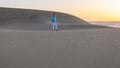 Young men walking at the beach of Maspalomas Gran Canaria Spain, men at the sand dunes desert Royalty Free Stock Photo