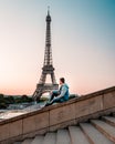 Young men watching Eiffel tower in Paris. guy tourist visiting Paris France by eiffel tower Royalty Free Stock Photo