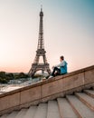 Young men watching Eiffel tower in Paris. guy tourist visiting Paris France by eiffel tower Royalty Free Stock Photo