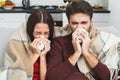 Young couple having evening at home sick runny nose