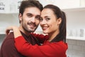 Young couple having romantic evening at home in the kitchen looking camera close-up Royalty Free Stock Photo