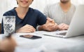 Young man and woman planning with professional consultant.