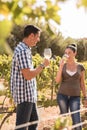 A young man and woman sipping wine