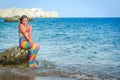 Young mermaid girl on tropical beach