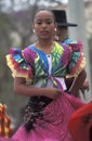 Young mexican woman dancing in traditional costume