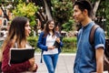 Young mexican woman in group of Latin students in university in Latin America