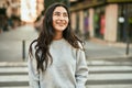 Young middle east girl smiling happy standing at the city