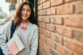 Young middle east student girl smiling happy holding book at the city Royalty Free Stock Photo