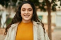 Young middle east woman smiling happy standing at the city