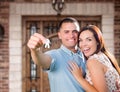 Young Military Couple In Front of Front Door of New House Holding Keys Royalty Free Stock Photo