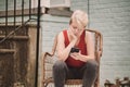 Non-binary gender millennial person sitting in chair