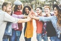 Young millennials friends stacking hands together - Happy students celebrating together - Youth lifestyle, university, social Royalty Free Stock Photo