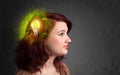 Young mind thinking of green eco energy with lightbulb Royalty Free Stock Photo