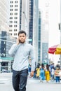 Young Mix Race American Man talking on cell phone, traveling in New York City Royalty Free Stock Photo