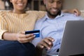 Young mix raced married couple shopping online from home Royalty Free Stock Photo