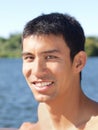 Young mixed man outdoors portrait at river