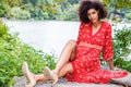 Young Mixed Race African American Woman with afro long curly hair traveling, relaxing at Central Park, New York City Royalty Free Stock Photo