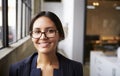 Young mixed race businesswoman wearing glasses, close up