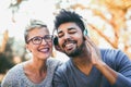 Young mixed race couple listening to music on headphones Royalty Free Stock Photo