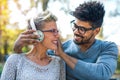 Young mixed race couple listening to music on headphones Royalty Free Stock Photo