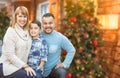 Young Mixed Race Family In Front of Christmas Tree Royalty Free Stock Photo