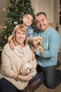 Young Mixed Race Family In Front of Christmas Tree Royalty Free Stock Photo