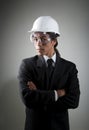 Young mixed race man in hard hat and safety goggle Royalty Free Stock Photo