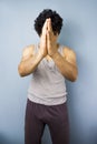 Young mixed race man in praying yoga pose