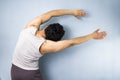 Young mixed race man in yoga side stretch