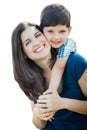 Young Mixed Race Mother and Son Hug Isolated on a White Background Royalty Free Stock Photo