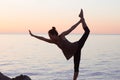 Young mixed race sporty woman do exercises on the beach in morning Royalty Free Stock Photo