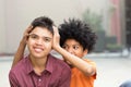 Young mixed race teenage brothers looking at the camera