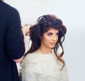 Curls this beautiful need a professional touch. A young model at the hair salon having her hair done. Royalty Free Stock Photo