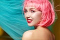 Young woman in pink wig. Beautiful model with fashion makeup. Bright spring look. hair color, medium hairstyle