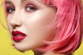 Young woman in pink wig. Beautiful model with fashion makeup. Bright spring look. hair color, medium hairstyle Royalty Free Stock Photo