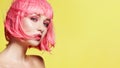 Young Model in Pink Wig. Beautiful Model with Fashion Makeup. Bright Spring Look. Sexy Hair Color, Medium Hairstyle Royalty Free Stock Photo