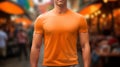 Young model shirt mockup, boy wearing orange t-shirt on street in daylight. Shirt mockup template on hipster adult for design