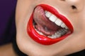 Young model showed tongue with beautiful lips red lipstick