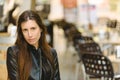 Young model woman with long straight hair wearing leather jacket posing carefree and casual on the street Royalty Free Stock Photo