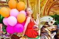 Young model woman riding a carousel Royalty Free Stock Photo