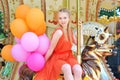 Young model woman riding a carousel Royalty Free Stock Photo