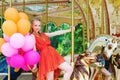 Young model woman riding a carousel Royalty Free Stock Photo