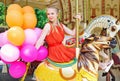 Young model woman riding a carousel Royalty Free Stock Photo