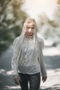 Young model woman walking down the road in stylish clothes Royalty Free Stock Photo