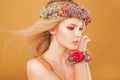 Young model with wreath of bright flowers on her Royalty Free Stock Photo